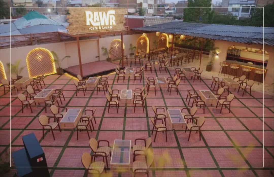 Aerial view of Rawr Cafe rooftop with full seating and live stage